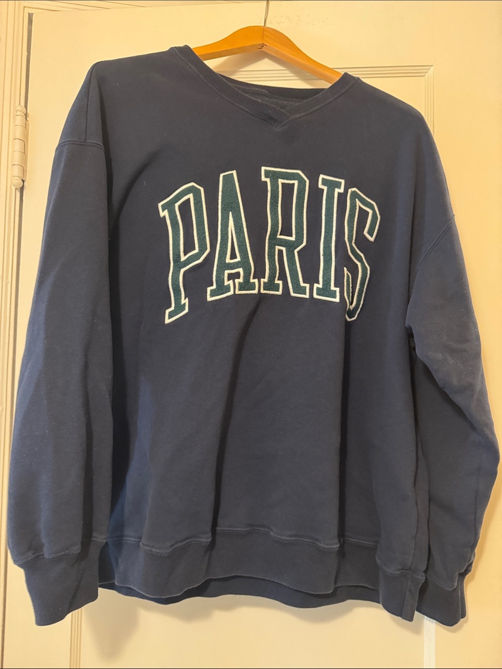 Hollister Navy V‑Neck Sweater with PARIS Appliqué